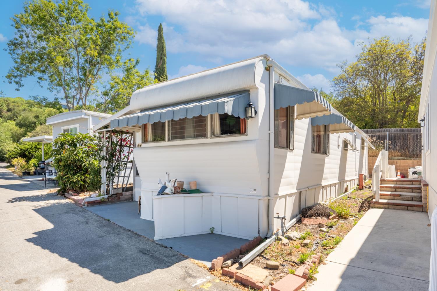 1075 Loma Drive, Unit 66 Ojai, CA 93023 - Photo 4 of 22 a view of a house with a backyard