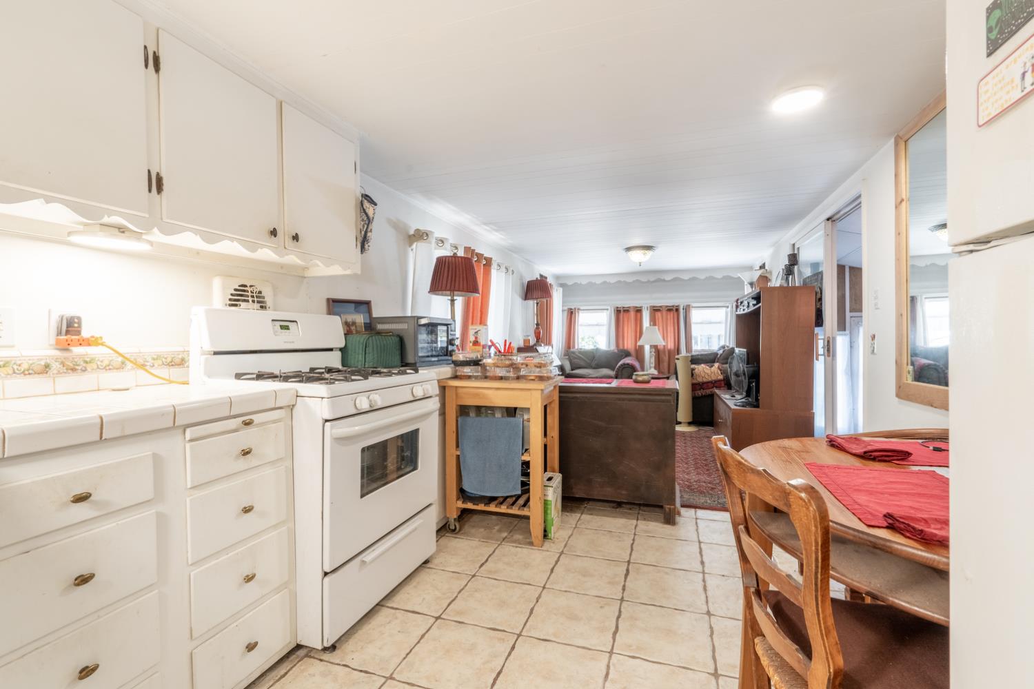 1075 Loma Drive, Unit 66 Ojai, CA 93023 - Photo 6 of 22 a kitchen that has a lot of cabinets in it and appliances