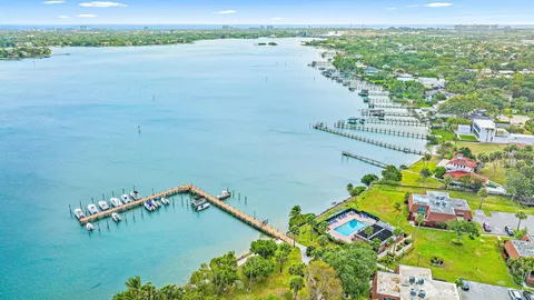 an aerial view of a house with a lake view