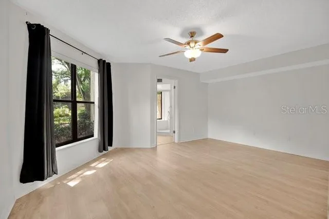 a large bathroom with a large tub and sink