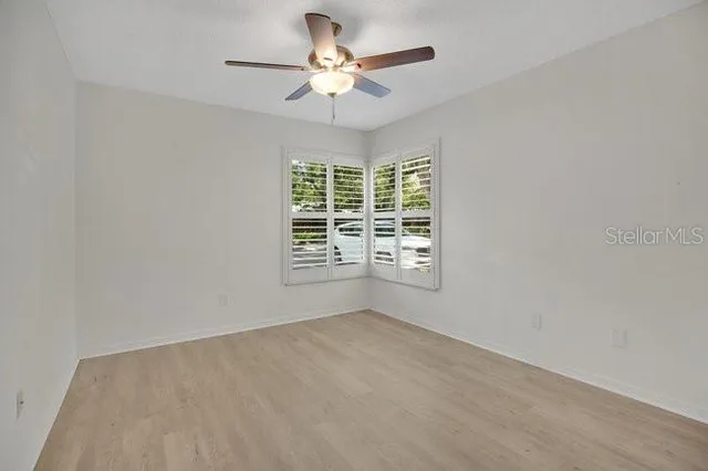 a bathroom with a sink toilet a mirror and shower