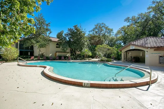 a view of a swimming pool with a patio