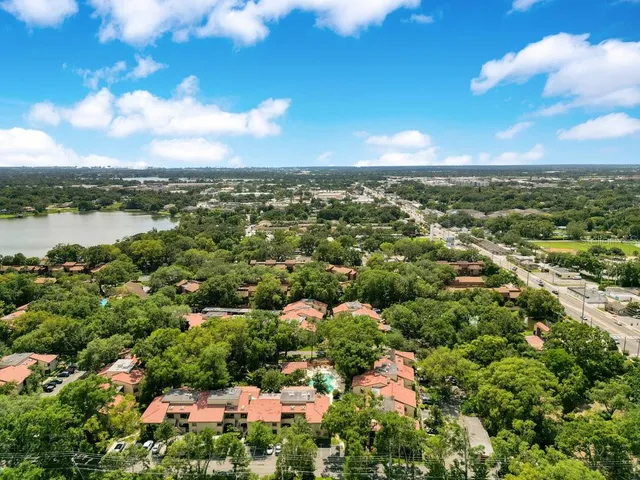 a street sign on a sidewalk next to a road