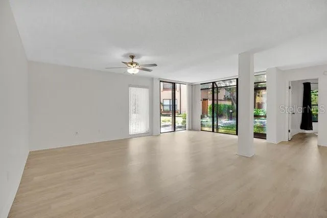 a view of an empty room with a window