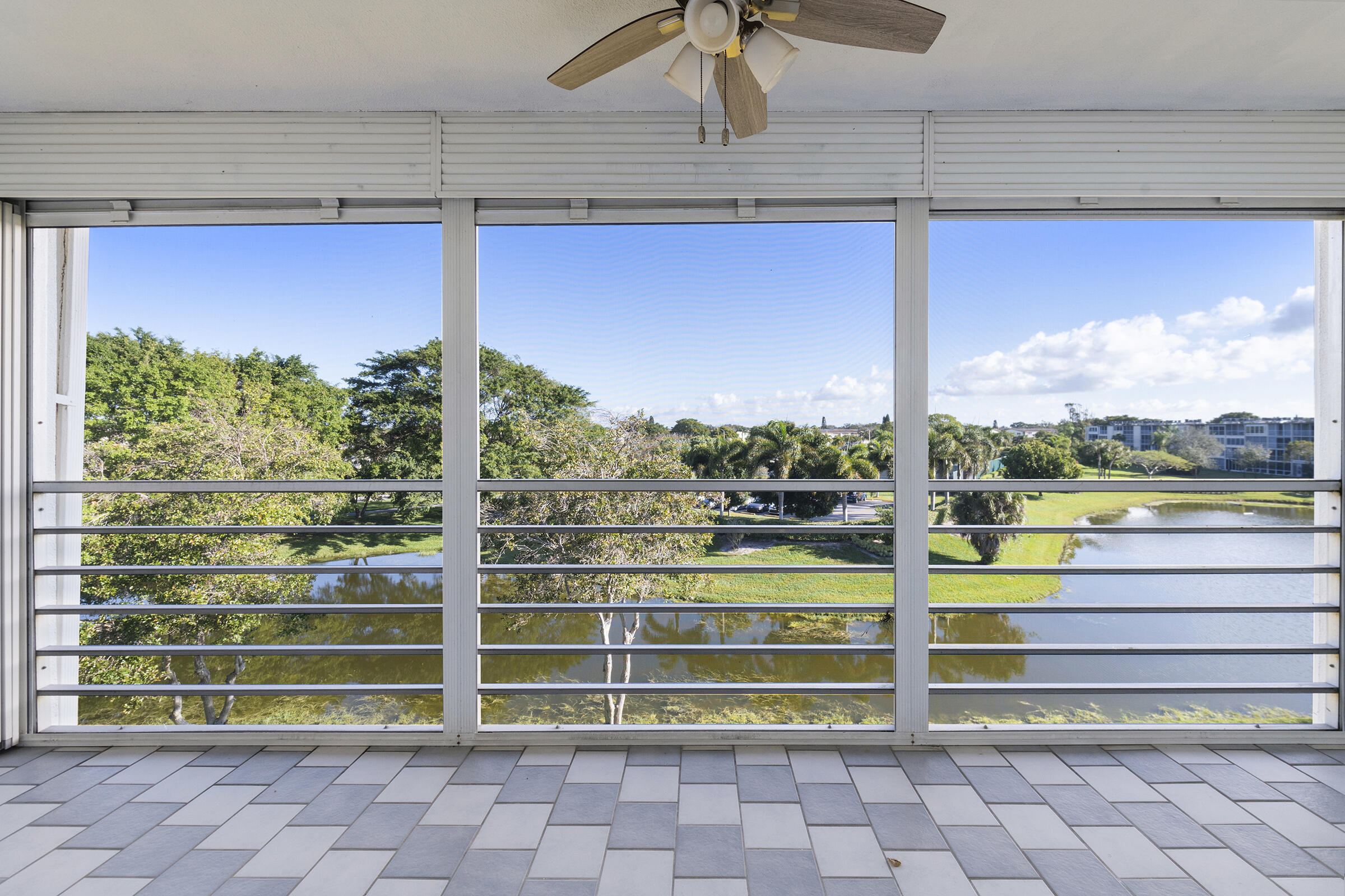 4043 Rexford Drive, Unit 4043 Boca Raton, FL 33434 - Photo 14 of 27 a view of a balcony with a ocean from a window