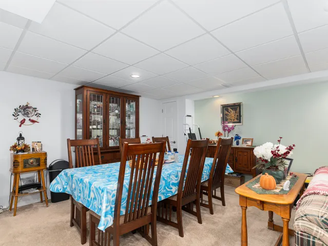a view of a dining room with furniture and window