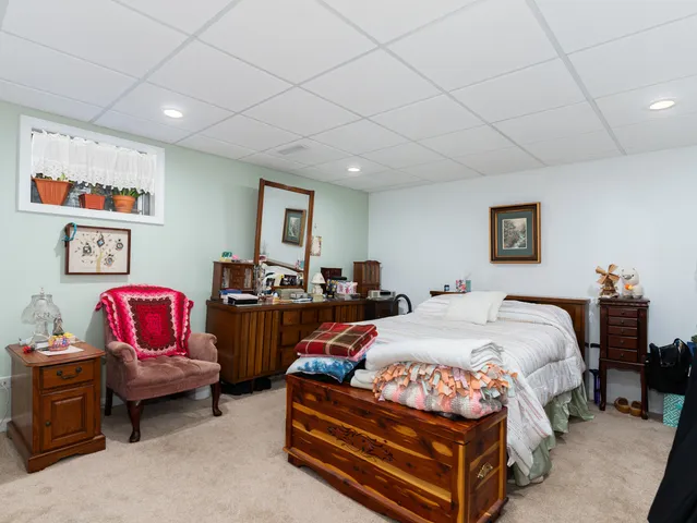 a bed room with bed and furniture