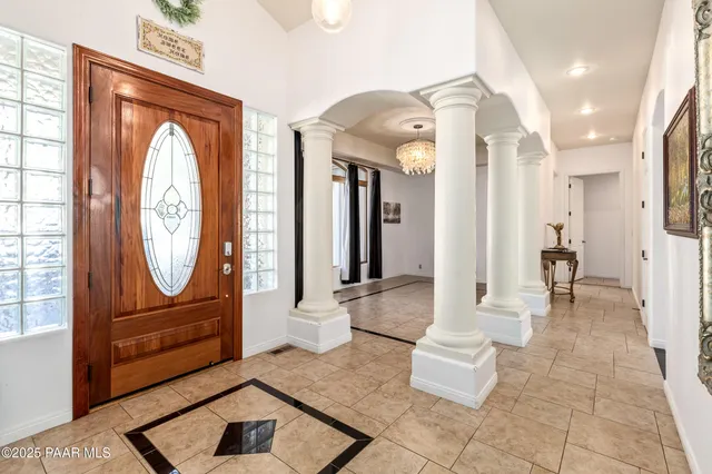 a living room with furniture a fireplace and a table