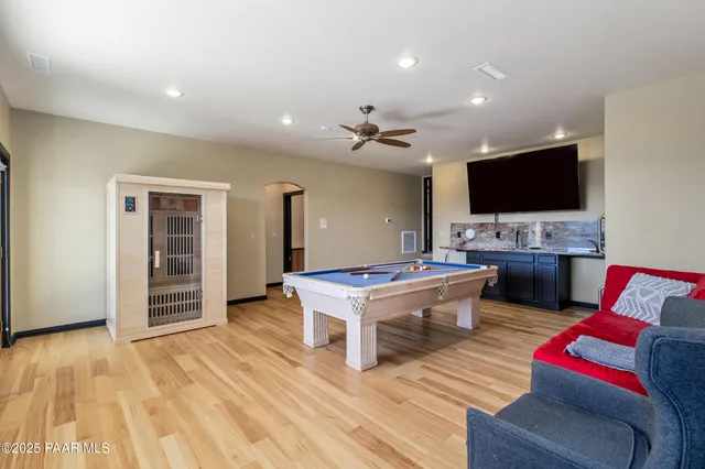 a view of a chairs and table in the backyard