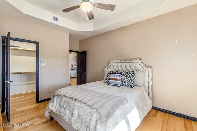 an aerial view of a house with a yard and lake view