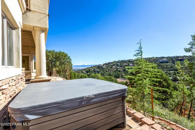 an aerial view of a house with a yard and fountain