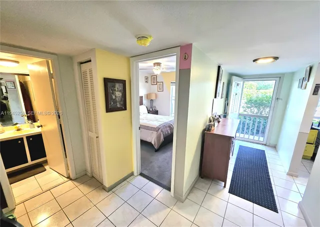 a bedroom with furniture and a rug