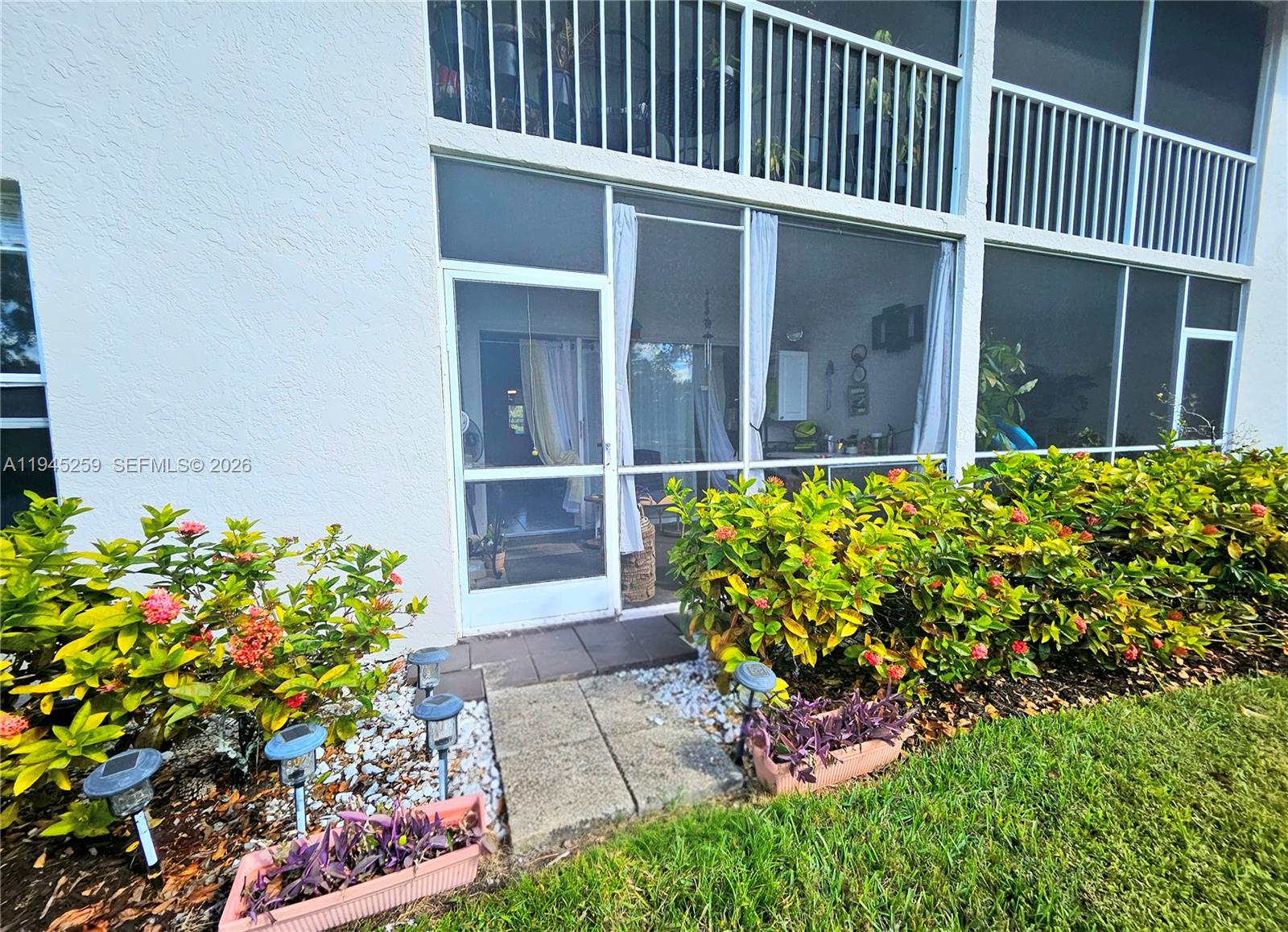 1448 Churchill Circle, Unit 103 Naples, FL 34116 - Photo 25 of 37 a view of a pathway in front of house