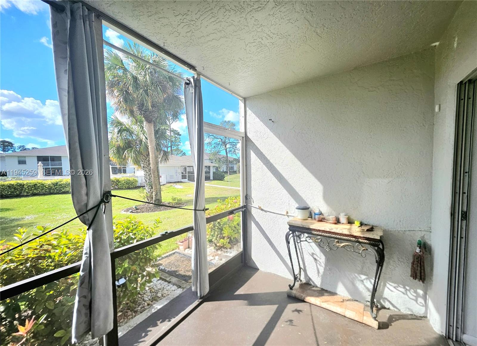 1448 Churchill Circle, Unit 103 Naples, FL 34116 - Photo 27 of 37 a view of an outdoor space with seating area