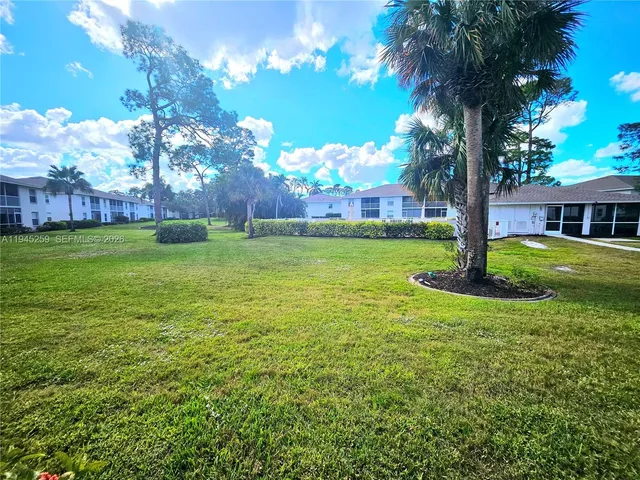 a view of a house with a big yard