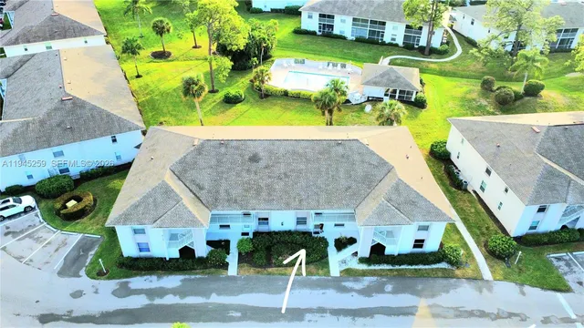 an aerial view of a house with a swimming pool