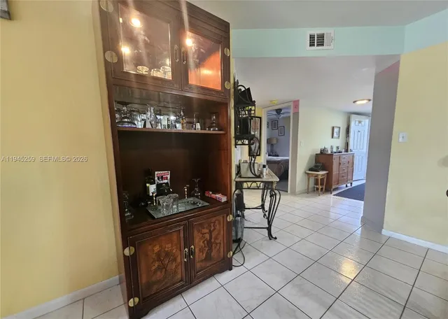 a kitchen with granite countertop a sink and cabinets