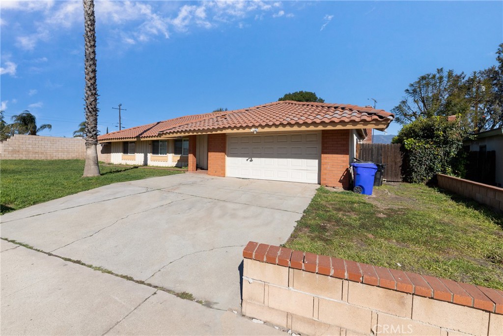1439 Terrace Road Rialto, CA 92376 - Photo 1 of 1 a blue bench sitting in front of a building