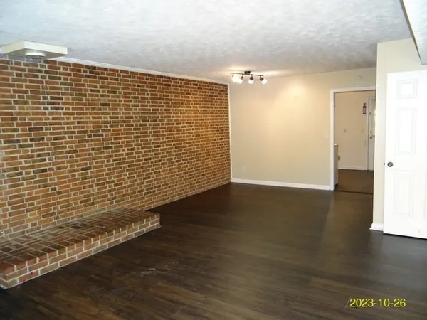 a view of a livingroom with wooden floor