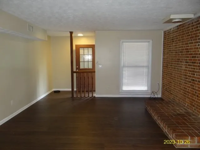 a kitchen with a refrigerator and cabinets