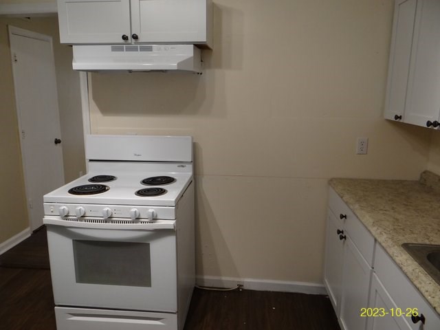 5664 St Marys Road, Unit B Columbus, GA 31907 - Photo 8 of 13 a stove top oven sitting inside of a kitchen