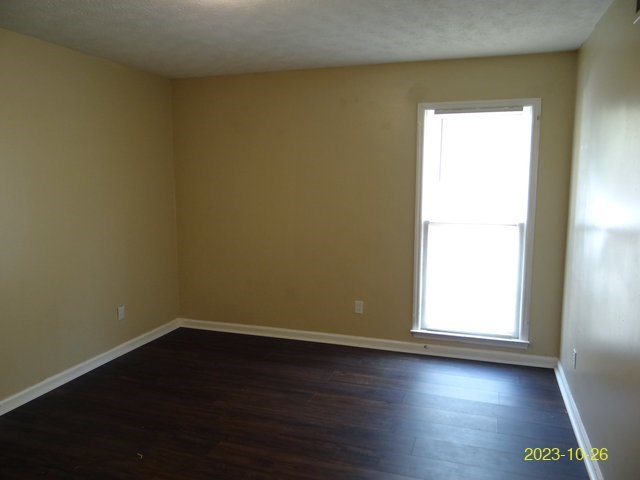 5664 St Marys Road, Unit B Columbus, GA 31907 - Photo 10 of 13 an empty room with wooden floor and windows