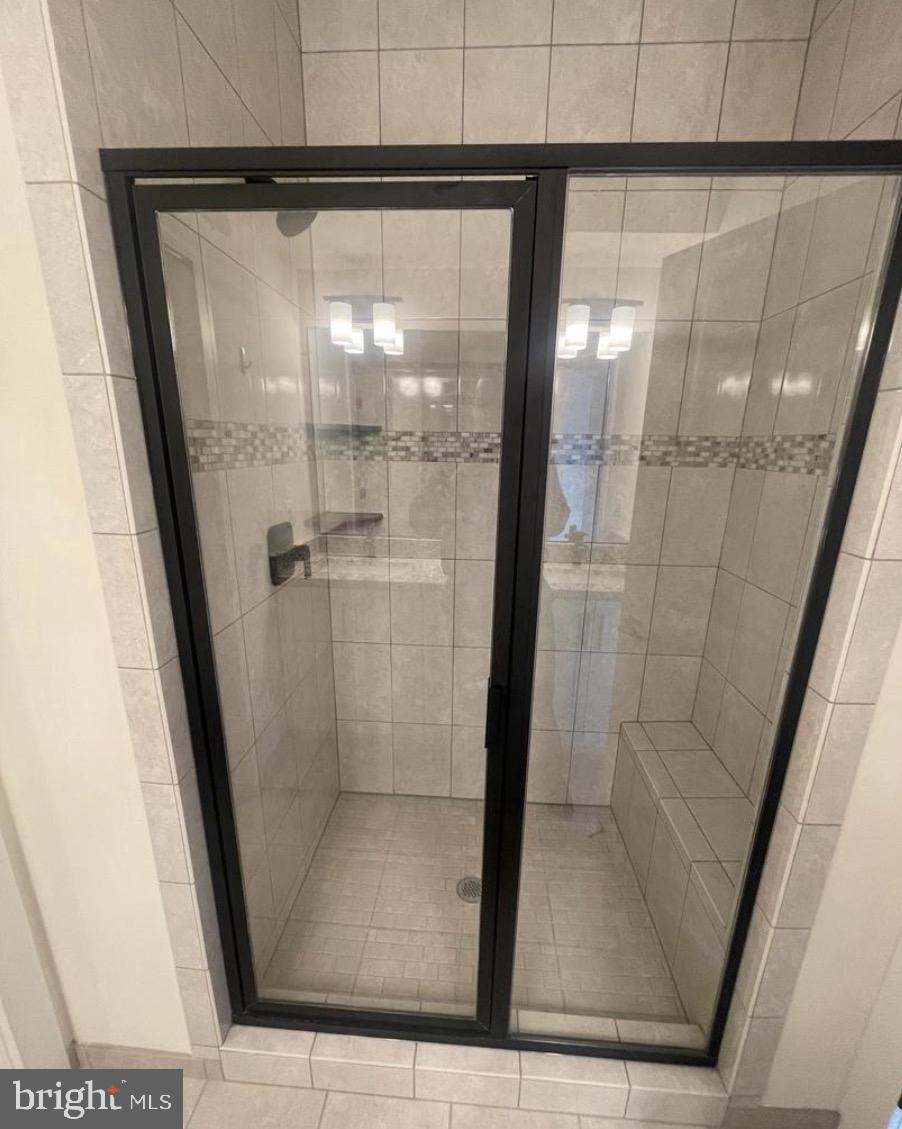 2228 South Glebe Road Arlington, VA 22204 - Photo 15 of 34 a bathroom with a glass shower door