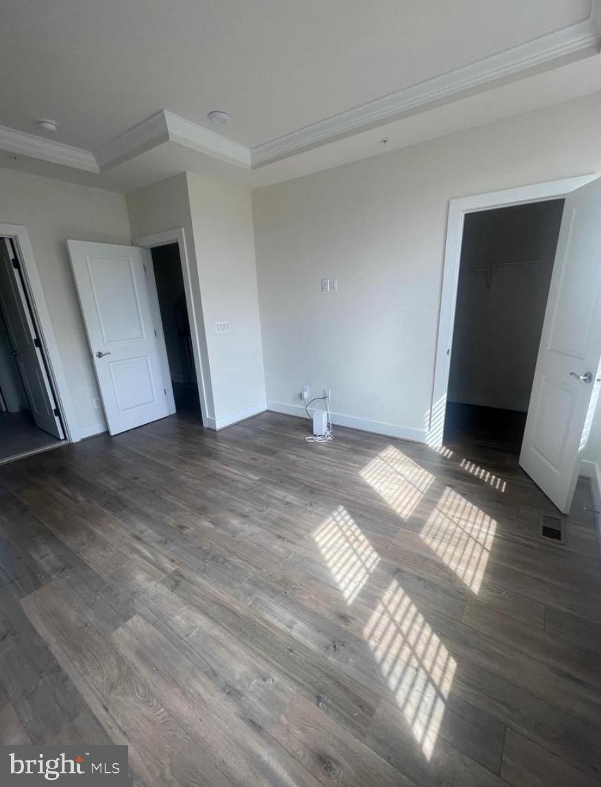 2228 South Glebe Road Arlington, VA 22204 - Photo 17 of 34 a view of an empty room with wooden floor and a window