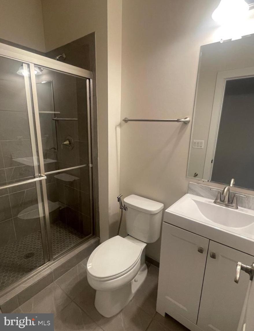 2228 South Glebe Road Arlington, VA 22204 - Photo 18 of 34 a white toilet sitting next to a bathroom sink