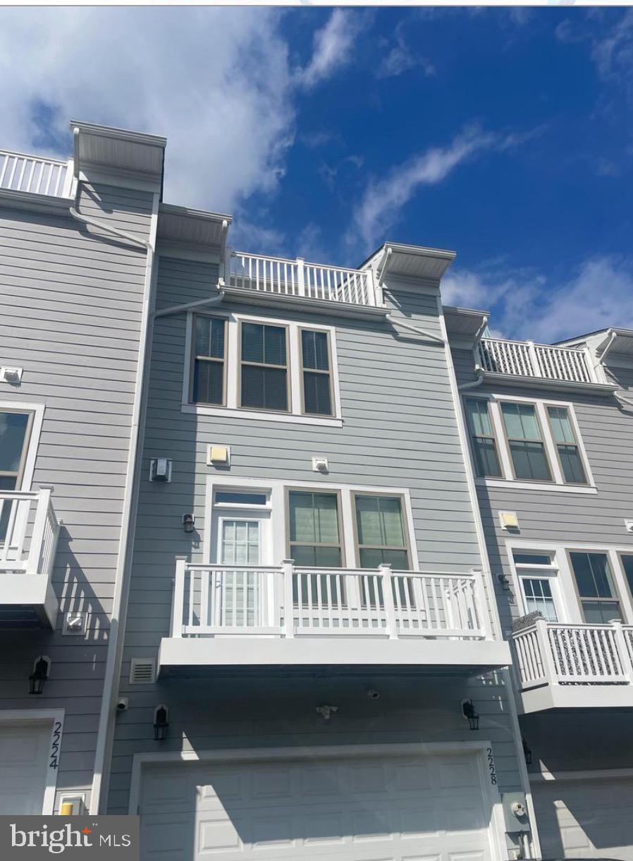 2228 South Glebe Road Arlington, VA 22204 - Photo 2 of 34 a view of a house with a balcony