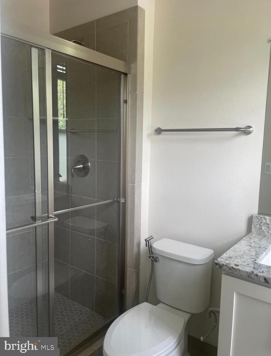 2228 South Glebe Road Arlington, VA 22204 - Photo 22 of 34 a white toilet sitting next to a bathroom sink