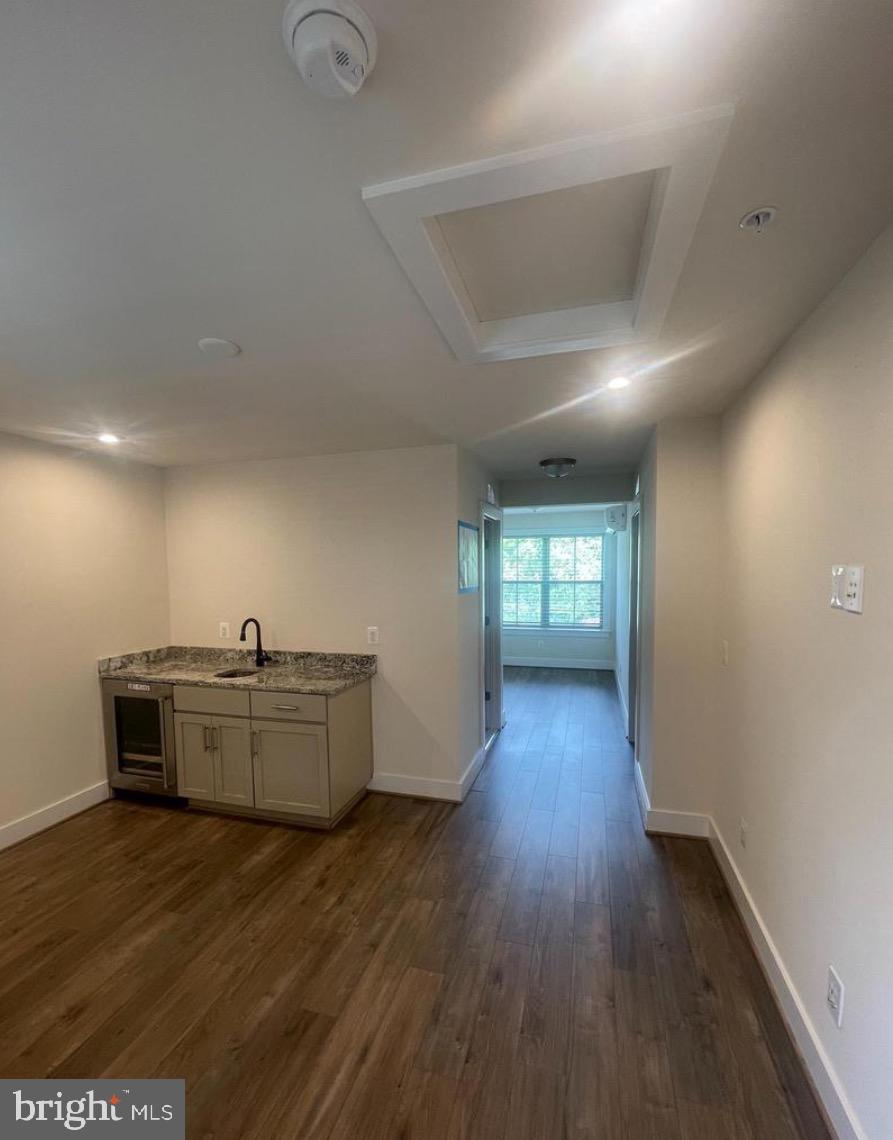 2228 South Glebe Road Arlington, VA 22204 - Photo 28 of 34 a kitchen with furniture and wooden floor