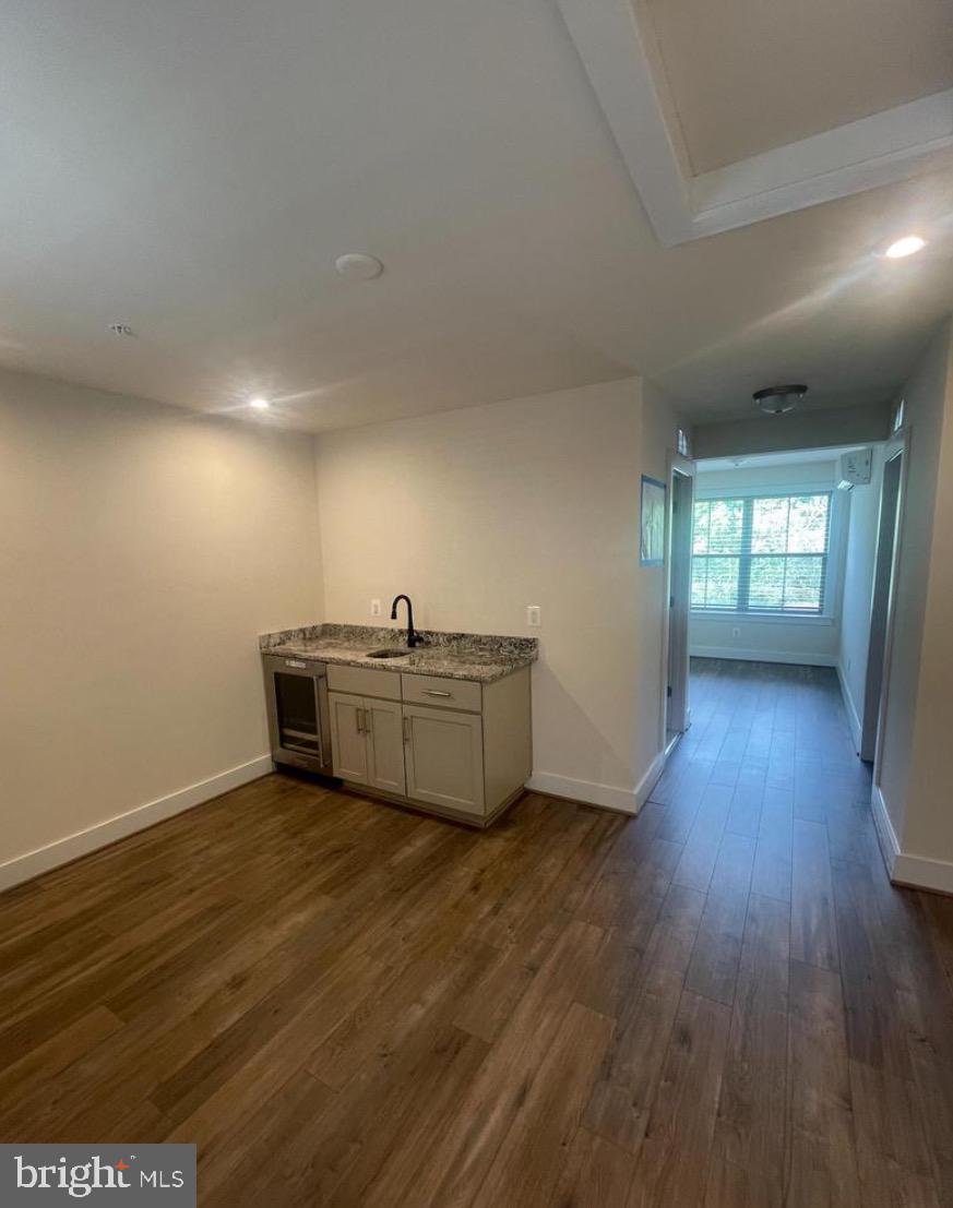 2228 South Glebe Road Arlington, VA 22204 - Photo 30 of 34 a view of an empty room with window and wooden floor