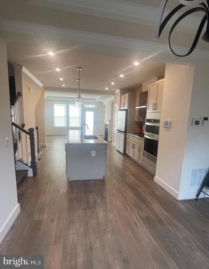 2228 South Glebe Road Arlington, VA 22204 - Photo 3 of 34 a open kitchen with stainless steel appliances granite countertop a stove and a refrigerator