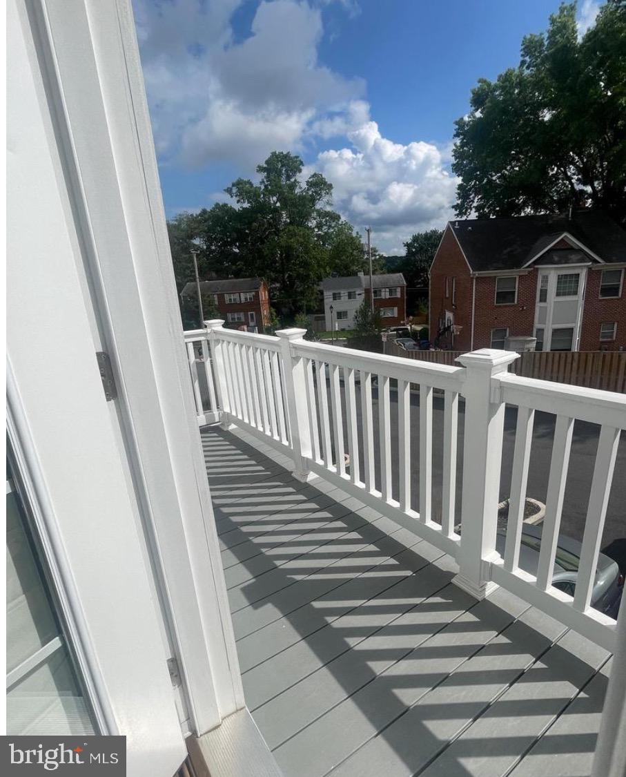 2228 South Glebe Road Arlington, VA 22204 - Photo 31 of 34 a view of balcony with wooden floor and fence