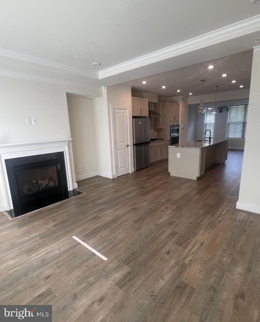2228 South Glebe Road Arlington, VA 22204 - Photo 4 of 34 a view of kitchen and kitchen with granite countertop wooden floor