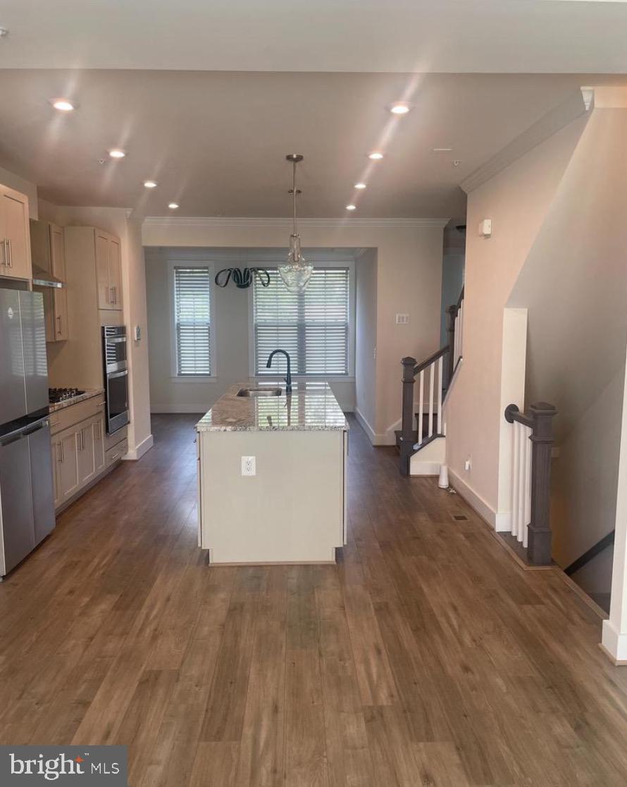 2228 South Glebe Road Arlington, VA 22204 - Photo 6 of 34 a view of a kitchen with a sink stainless steel appliances and cabinets