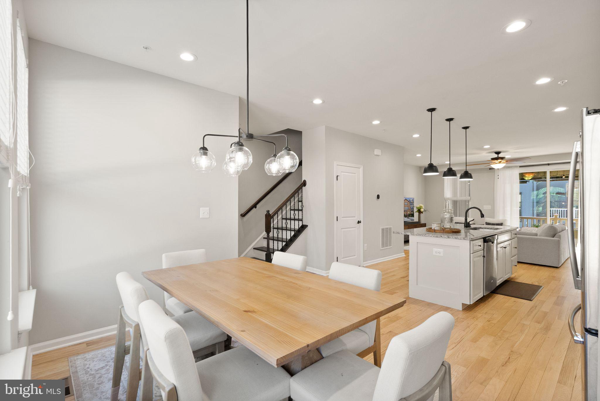 43405 Charitable Street Ashburn, VA 20148 - Photo 14 of 44 a large kitchen with a table and chairs
