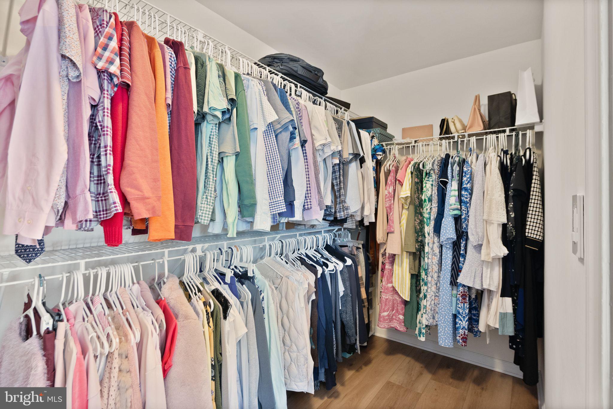 43405 Charitable Street Ashburn, VA 20148 - Photo 20 of 44 a view of walk in closet with clothes