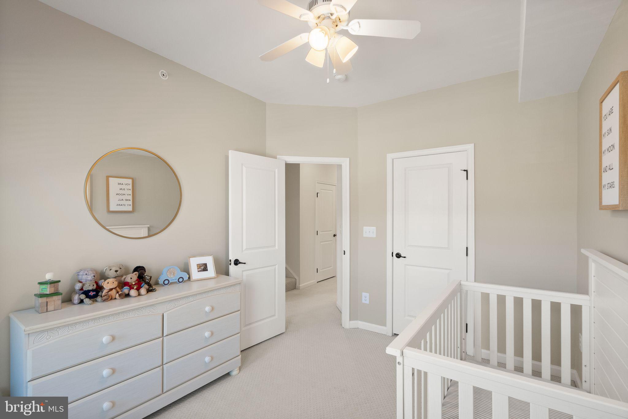 43405 Charitable Street Ashburn, VA 20148 - Photo 24 of 44 a room with a bed a mirror and a window