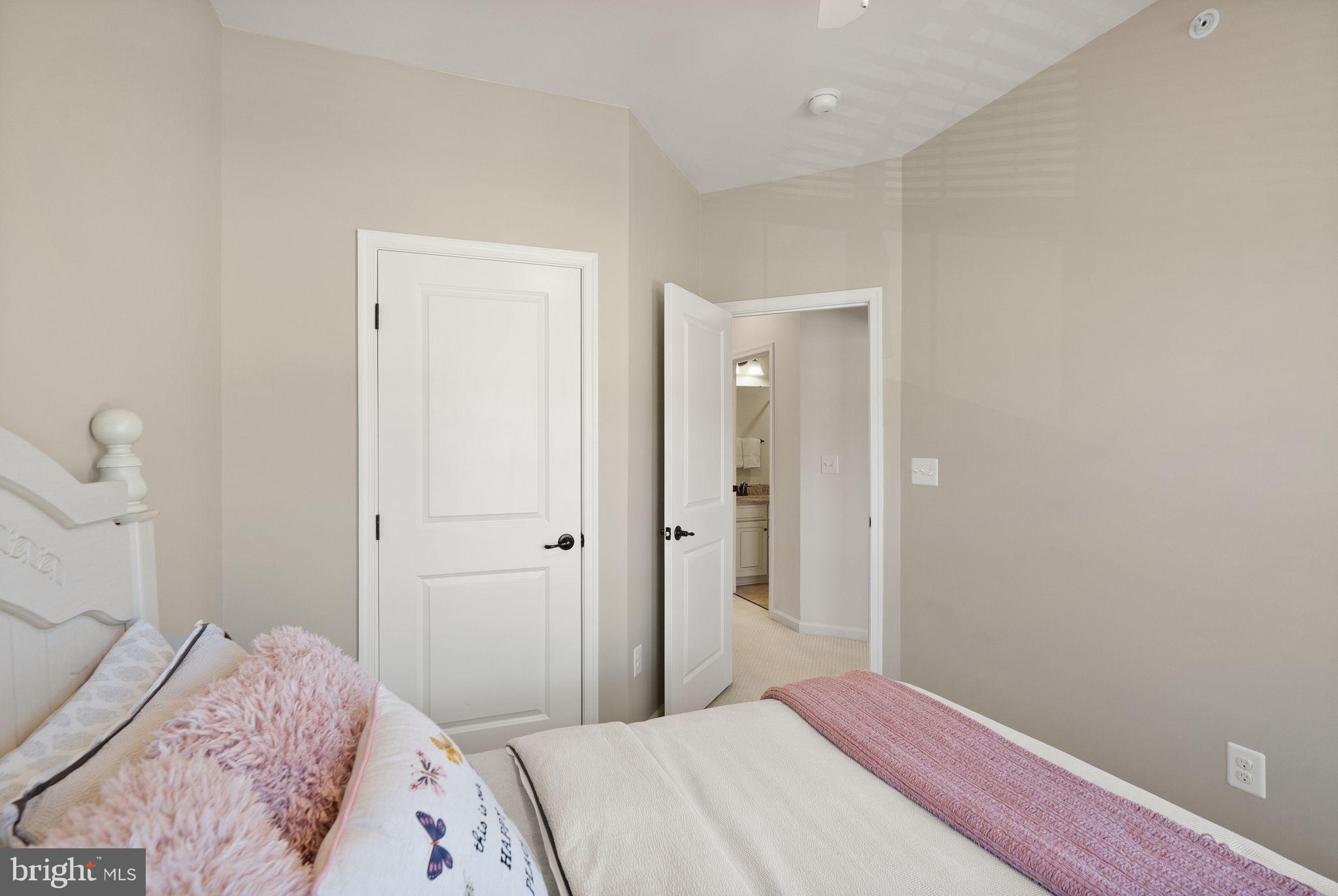 43405 Charitable Street Ashburn, VA 20148 - Photo 26 of 44 a bedroom with a bed and hallway