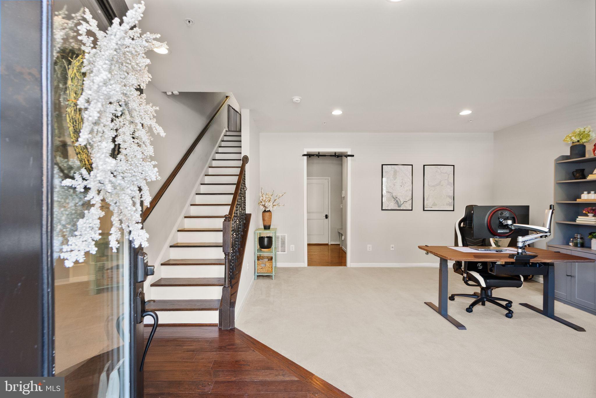 43405 Charitable Street Ashburn, VA 20148 - Photo 3 of 44 a workspace with wooden floor and a chandelier