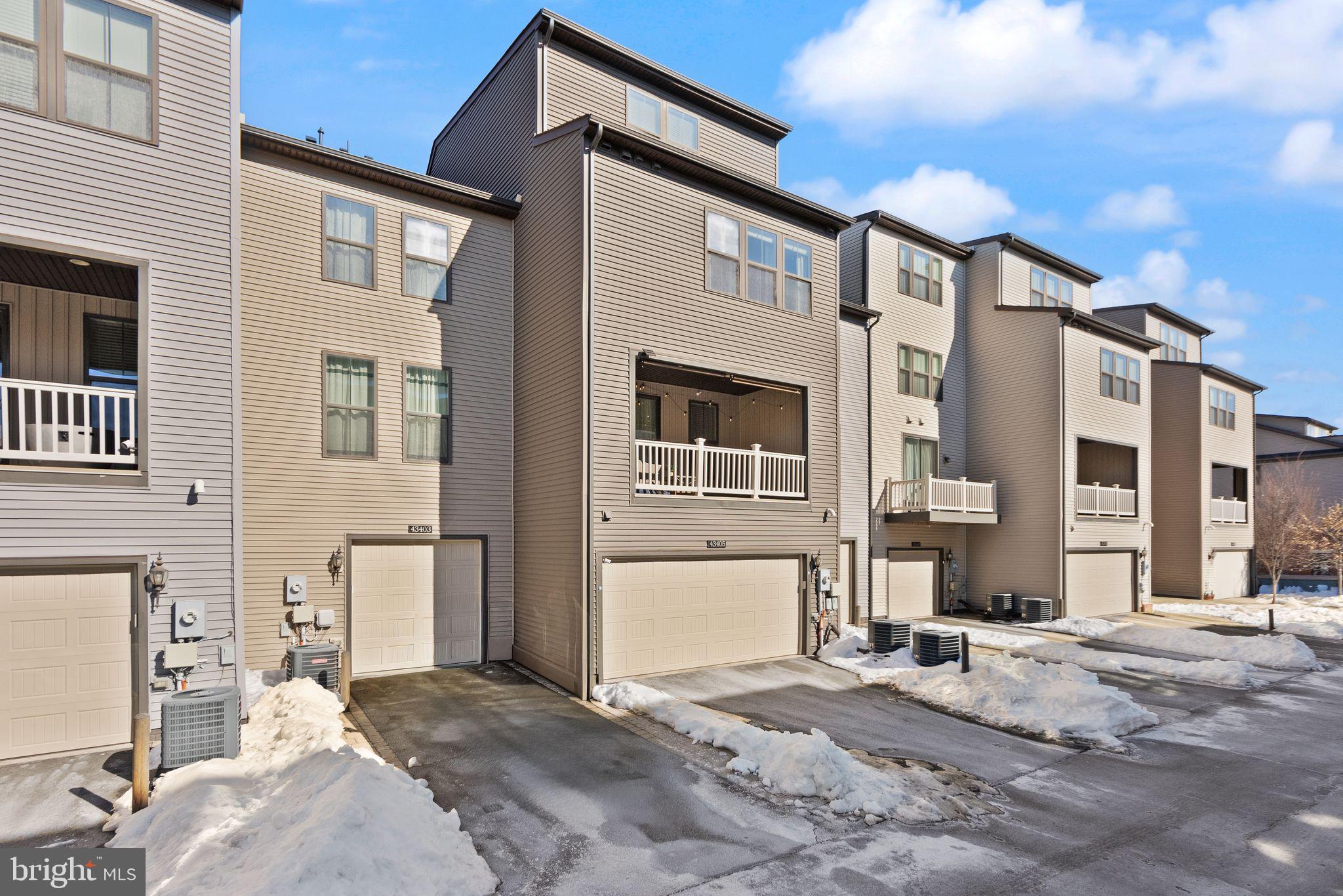 43405 Charitable Street Ashburn, VA 20148 - Photo 35 of 44 a front view of a house with a yard