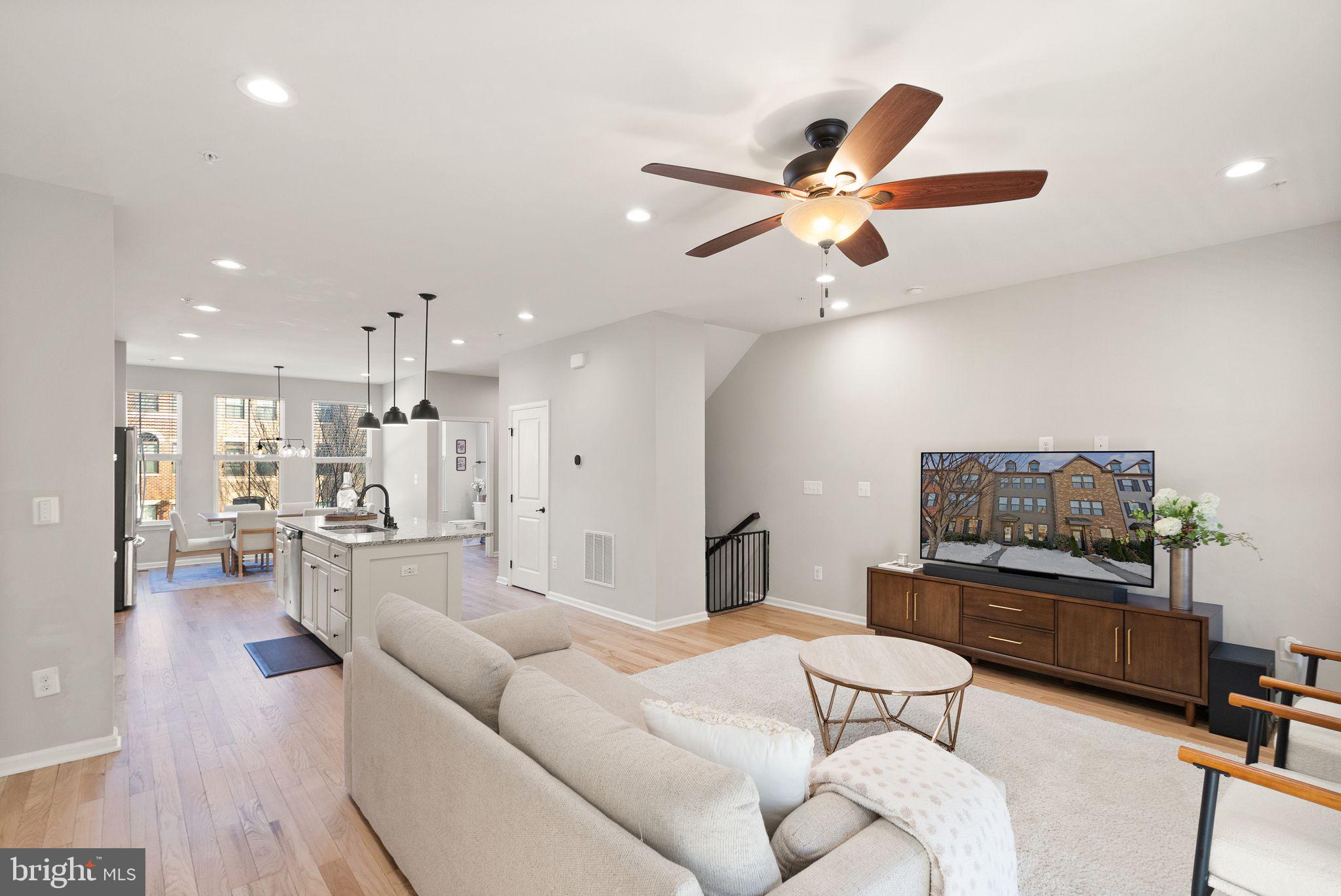 43405 Charitable Street Ashburn, VA 20148 - Photo 8 of 44 a living room with furniture and a ceiling fan