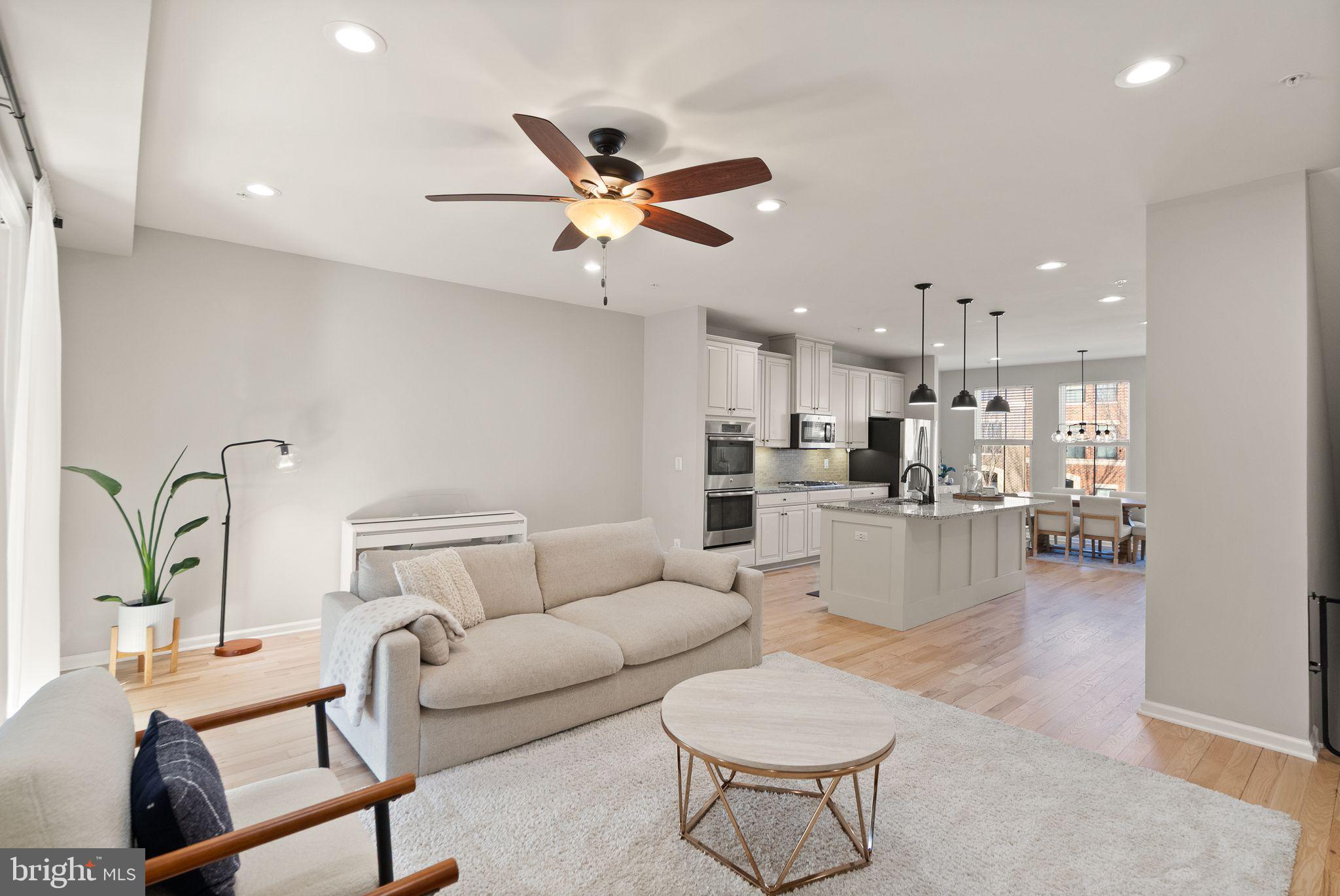 43405 Charitable Street Ashburn, VA 20148 - Photo 9 of 44 a living room with furniture and kitchen view