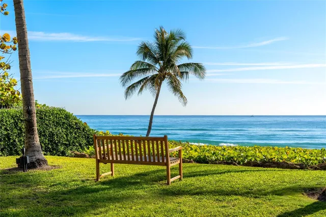 a front view of a house with swimming pool and porch