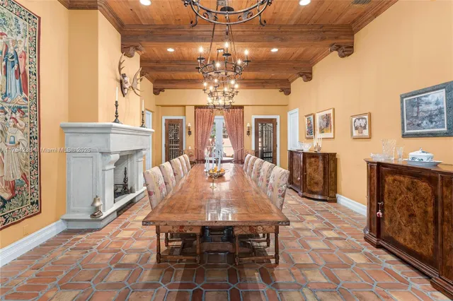 a view of staircase with lots of frames on wall and paintings on the wall
