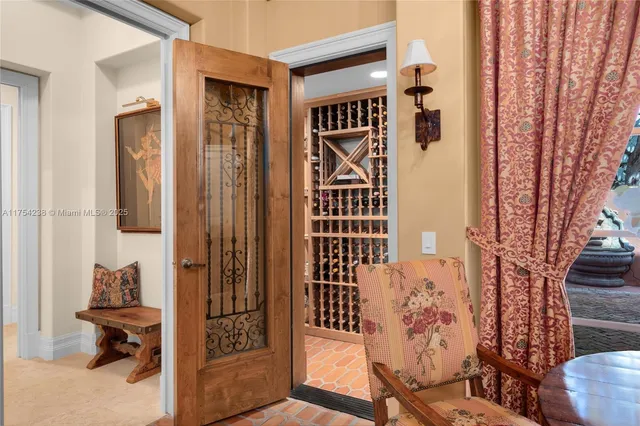 a living room with furniture and a book shelf