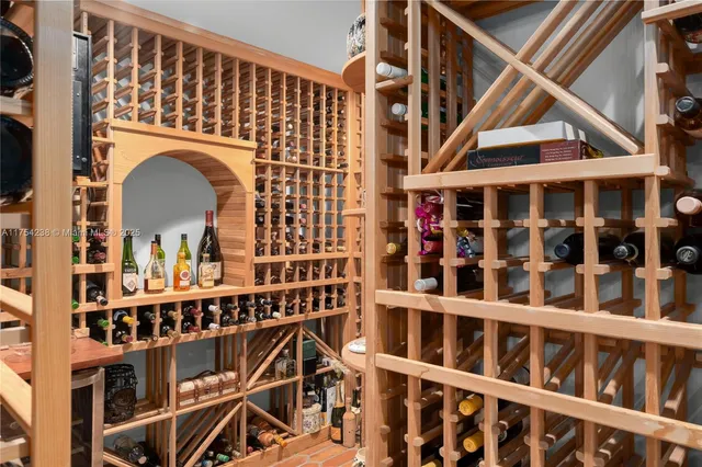 a spacious bedroom with a bed and glass windows