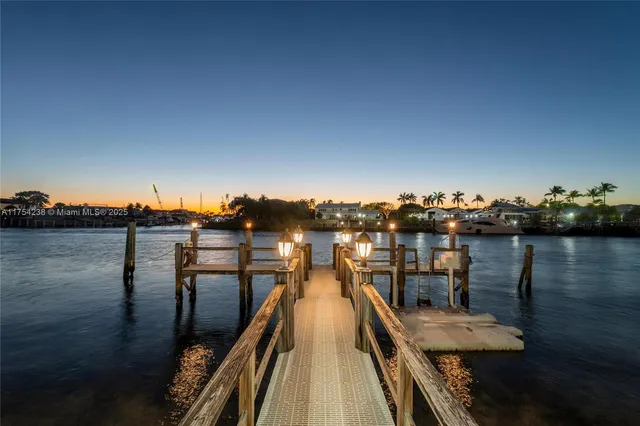 a living room with furniture and a painting on the wall